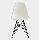A white plastic chair with black metal legs