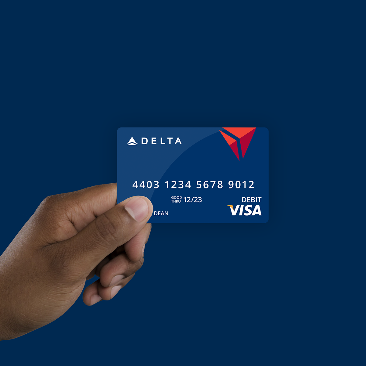 hand holding delta branded visa reward card