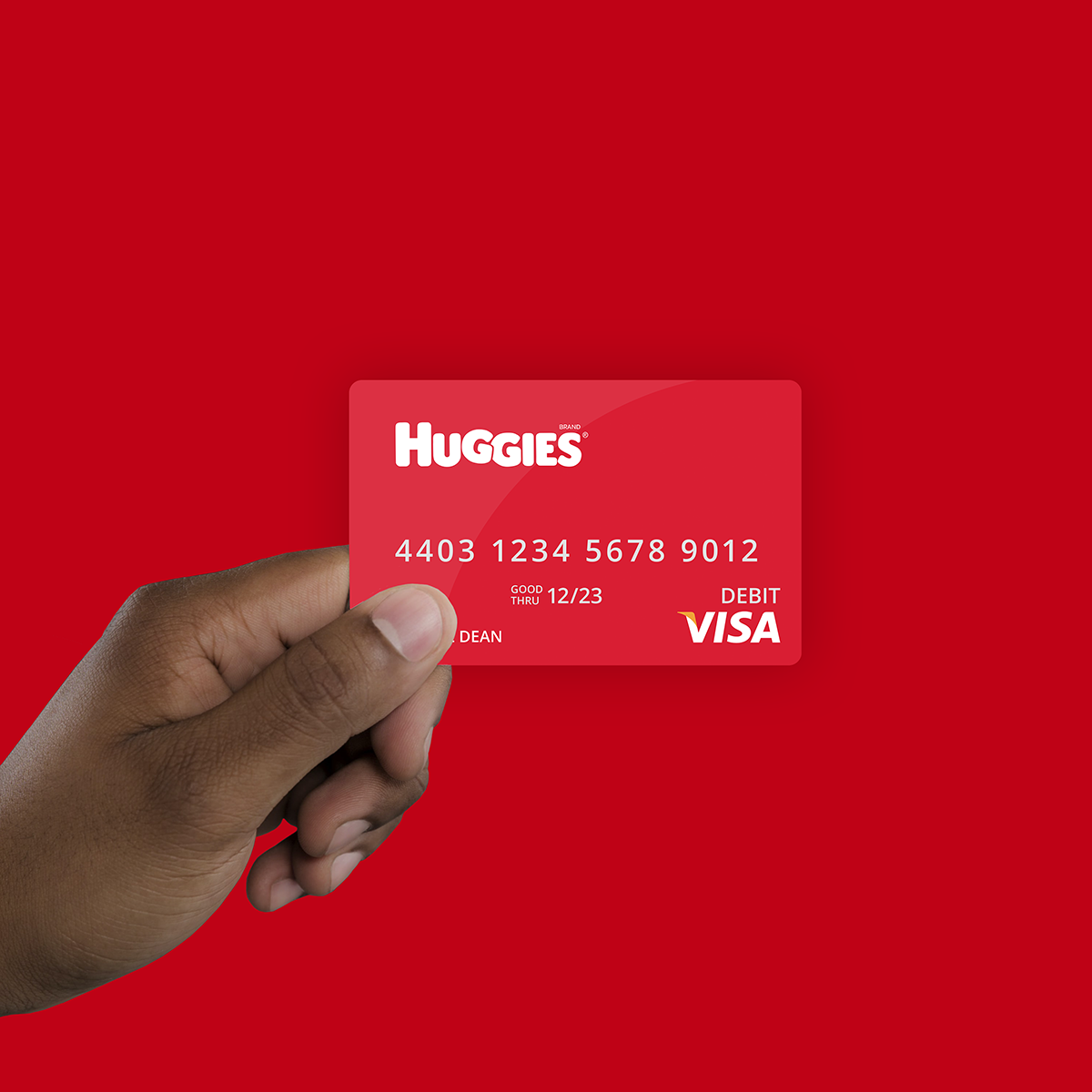 hand holding huggies branded visa gift card